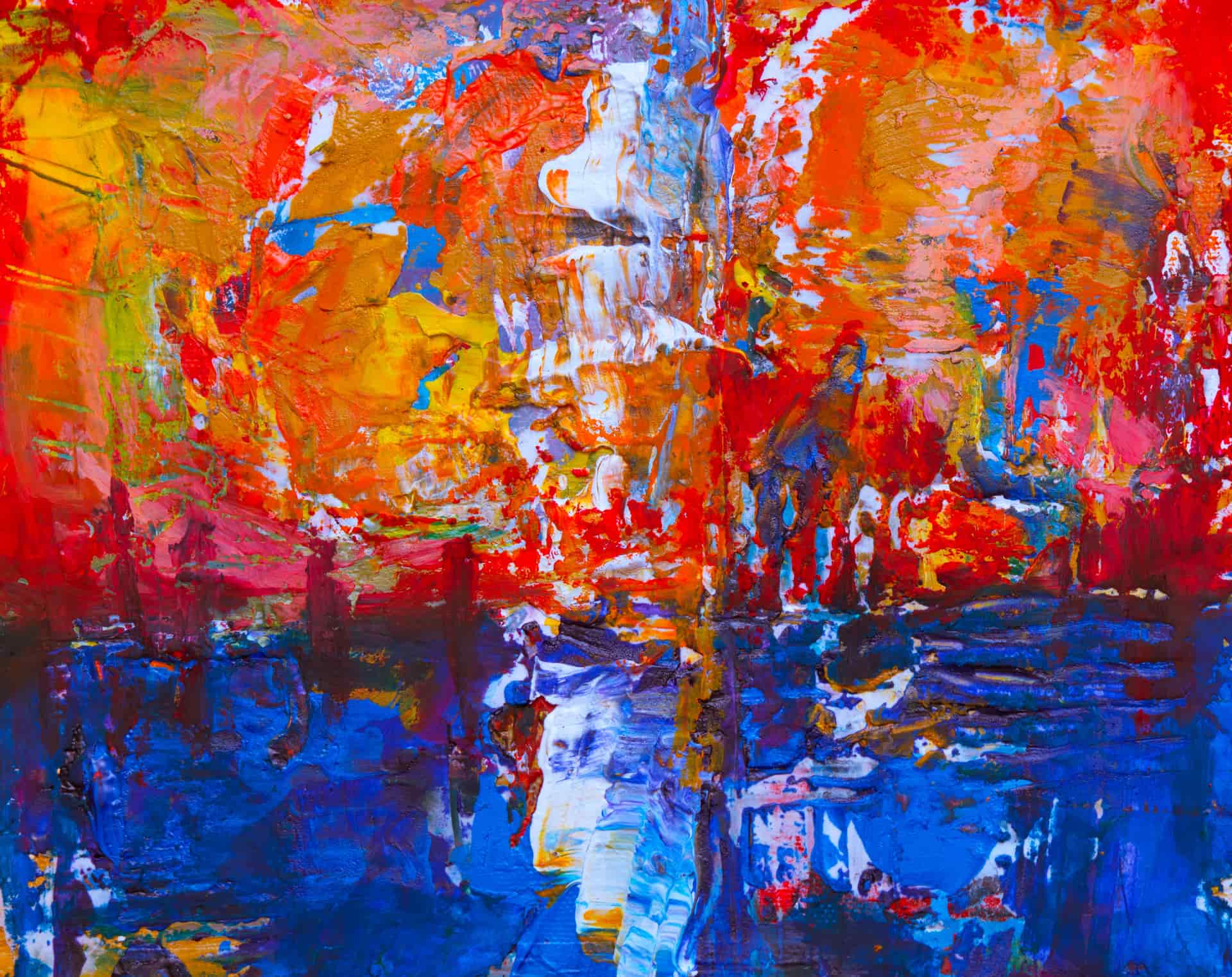 A vivid abstract print on a plain white wall