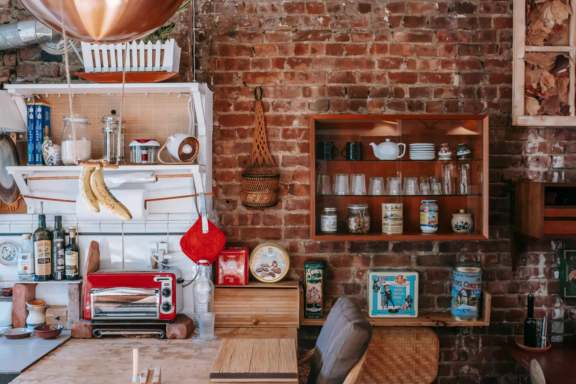 An exposed brick interior wall lit from one side