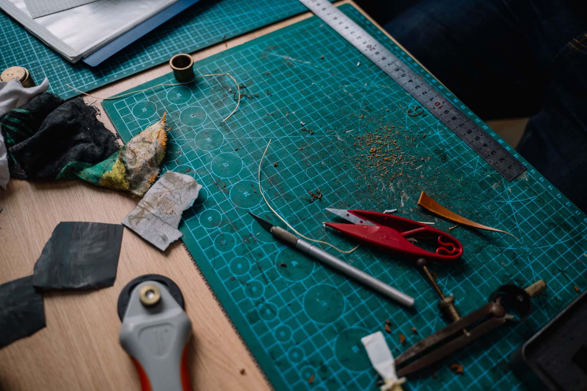 A cut mat board with a bevelled window opening on a work surface