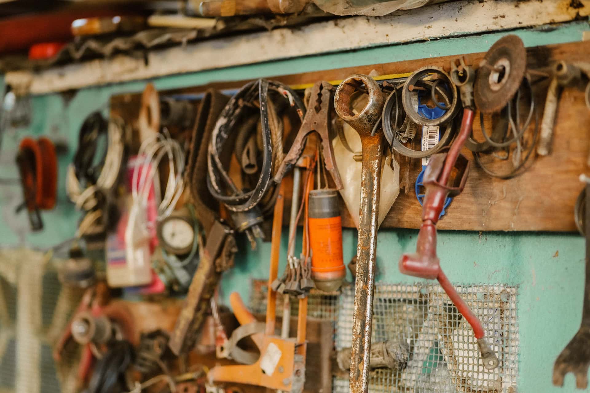 Picture-hanging hardware and a tape measure on a workbench