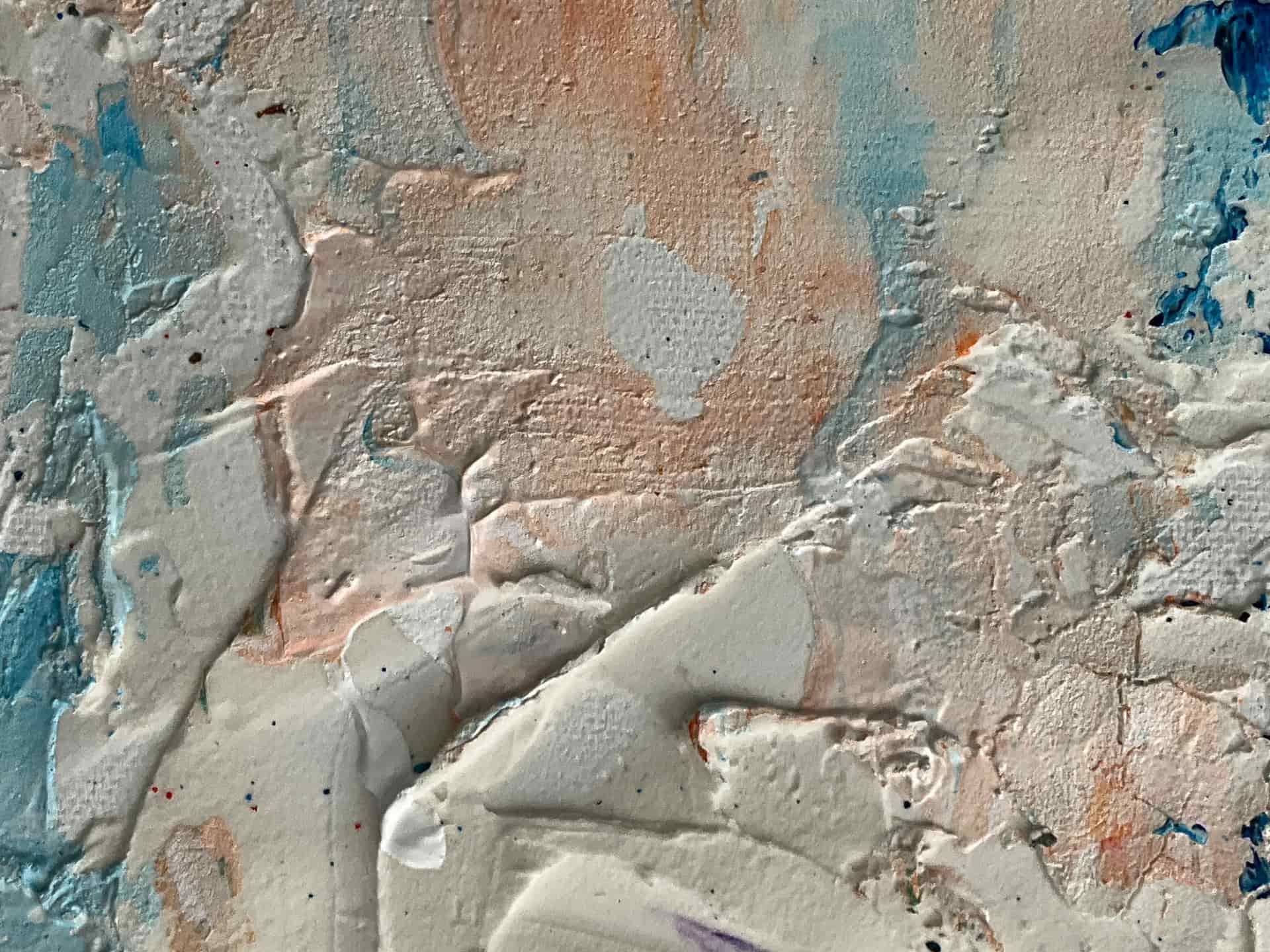 Close view of a textured painted interior wall in raking light