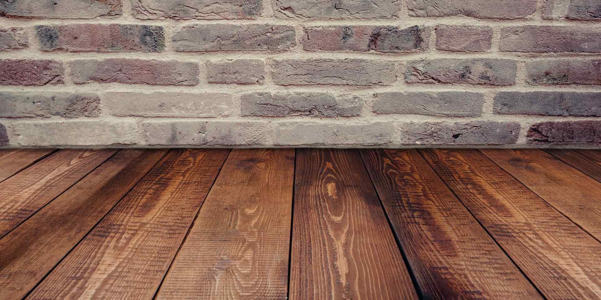An exposed brick interior wall in daylight