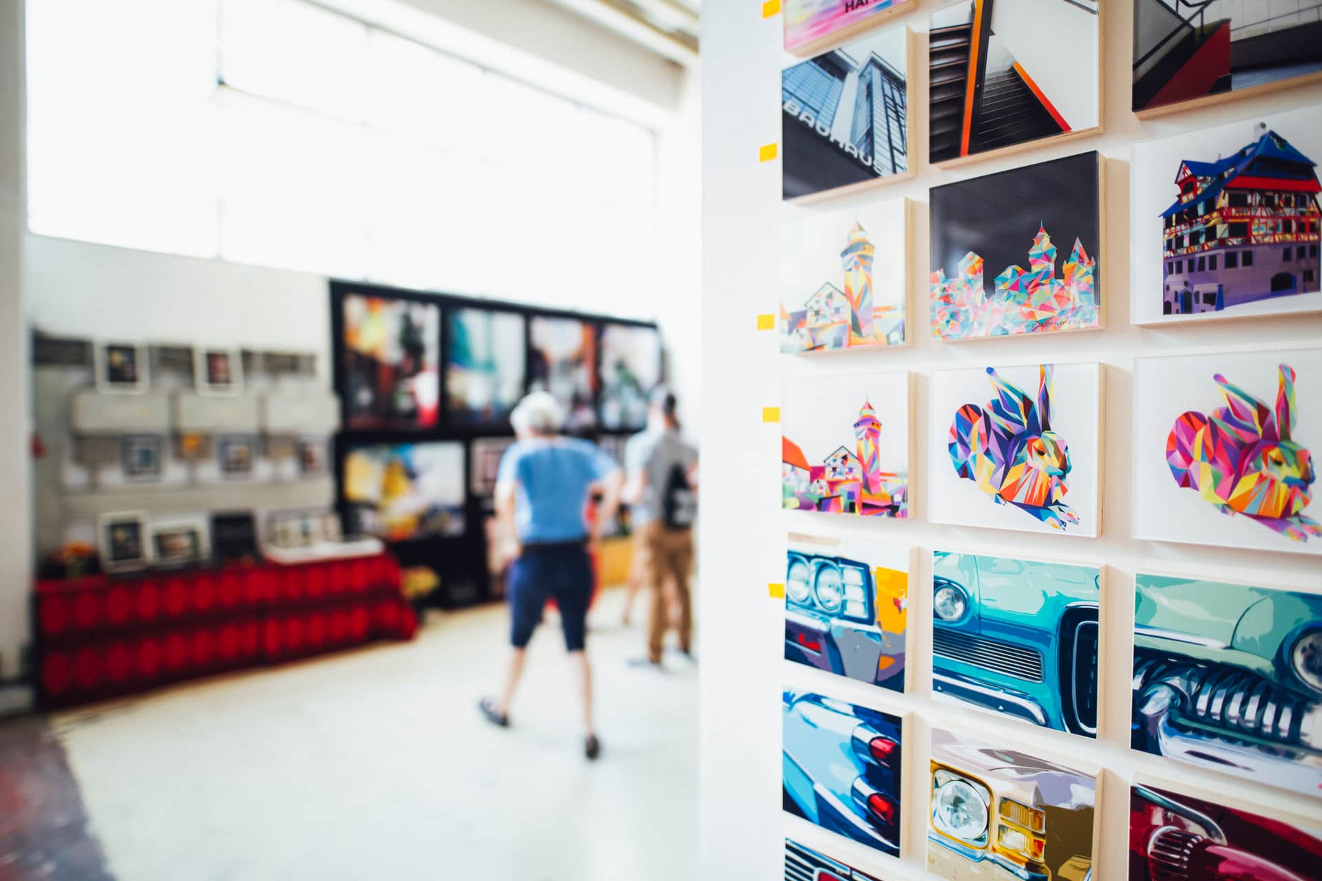 A large stretched canvas print hanging above a low sideboard